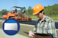 south-dakota map icon and a civil engineer inspecting a road building project