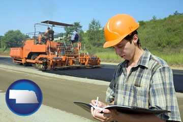 a civil engineer inspecting a road building project - with Nebraska icon